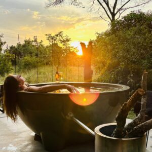 Hot Tub Sunset and Lady relaxing in the African Bush